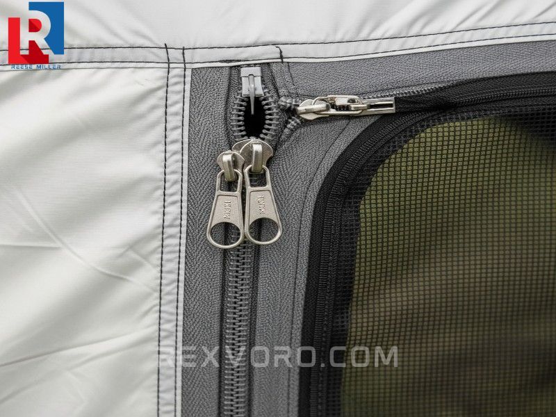 detail-of-heavy-duty-zippers-and-fine-no-see-um-mesh-on-the-entrance-of-the-best-tent-for-beach-camping-emphasizing-sand-resistance