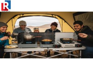family-enjoying-a-hot-meal-cooked-using-several-durable-butane-camp-stoves-at-a-remote-campsite