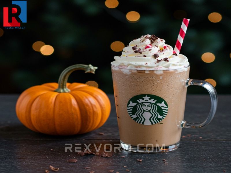 festive-peppermint-mocha-with-whipped-cream-and-chocolate-shavings-next-to-a-small-pumpkin