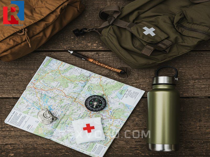 flat-lay-of-essential-hiking-gear-map-compass-water-bottle-and-first-aid-kit
