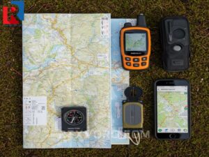hikers-navigation-kit-flat-lay-map-compass-gps-and-smartphone-trail-app