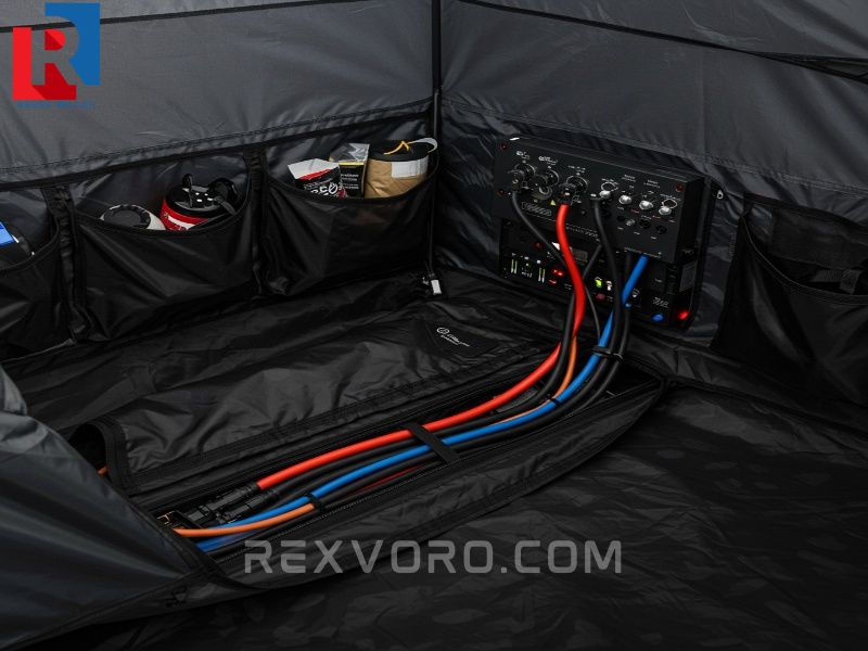 internal-view-of-a-sophisticated-stargazing-tent-showing-a-telescope-cable-access-port-and-organized-power-management-system
