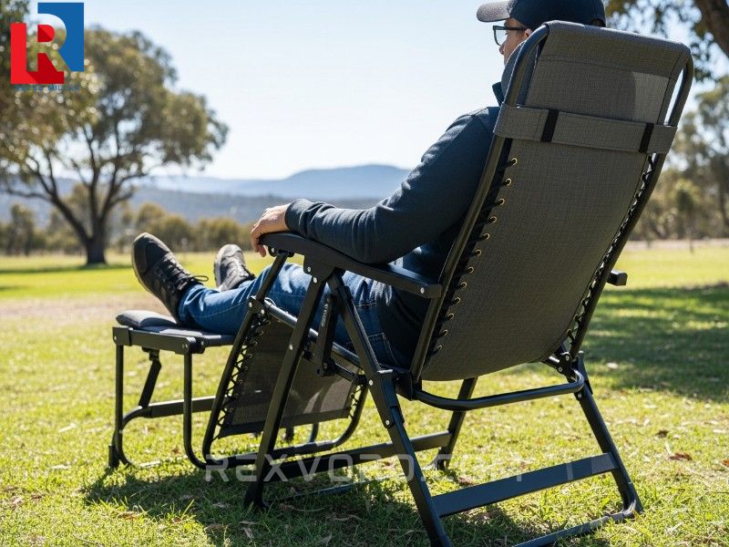 stable-zero-gravity-camping-chair-with-integrated-footrest-deployed-showing-a-person-comfortably-relaxing